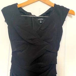 La chateau dress XS. Stretchy but thick material. Very flattering.